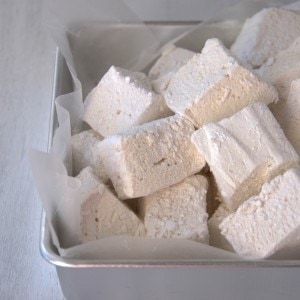 White marshmallow cubes in silver baking pan