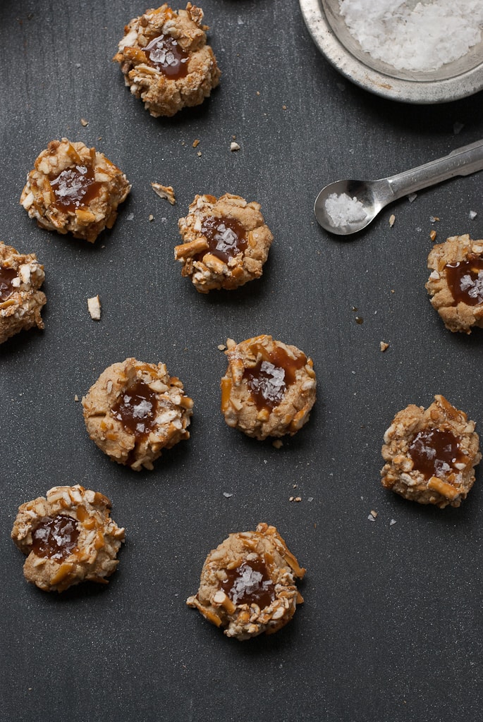 pretzel thumbprint cookies filled with caramel sprinkled with salt