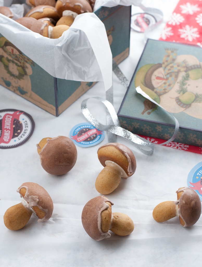 spiced mushroom cookies on a table with gift boxes