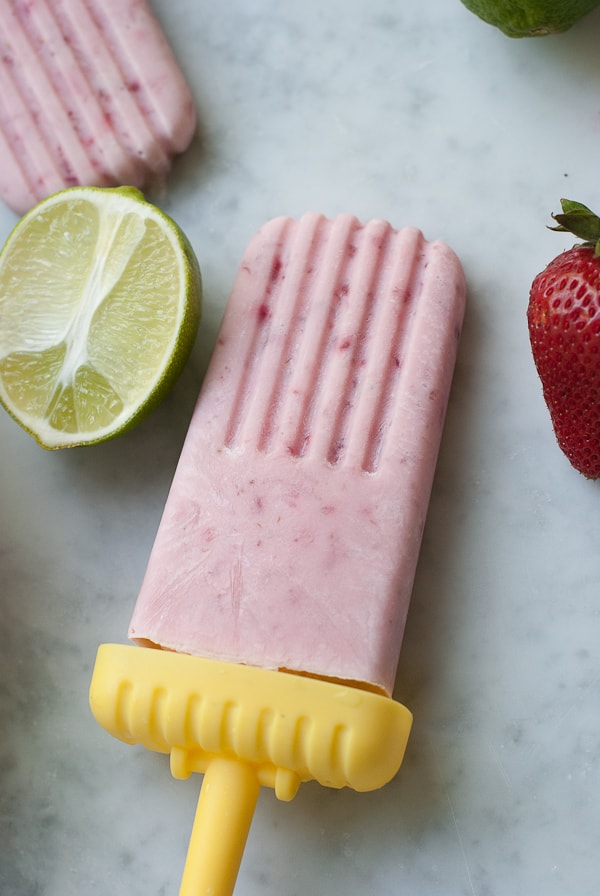 Strawberry Coconut Lime Popsicles. A healthy refreshing treat to cool you down on a hot summer day | www.PineappleandCoconut.com
