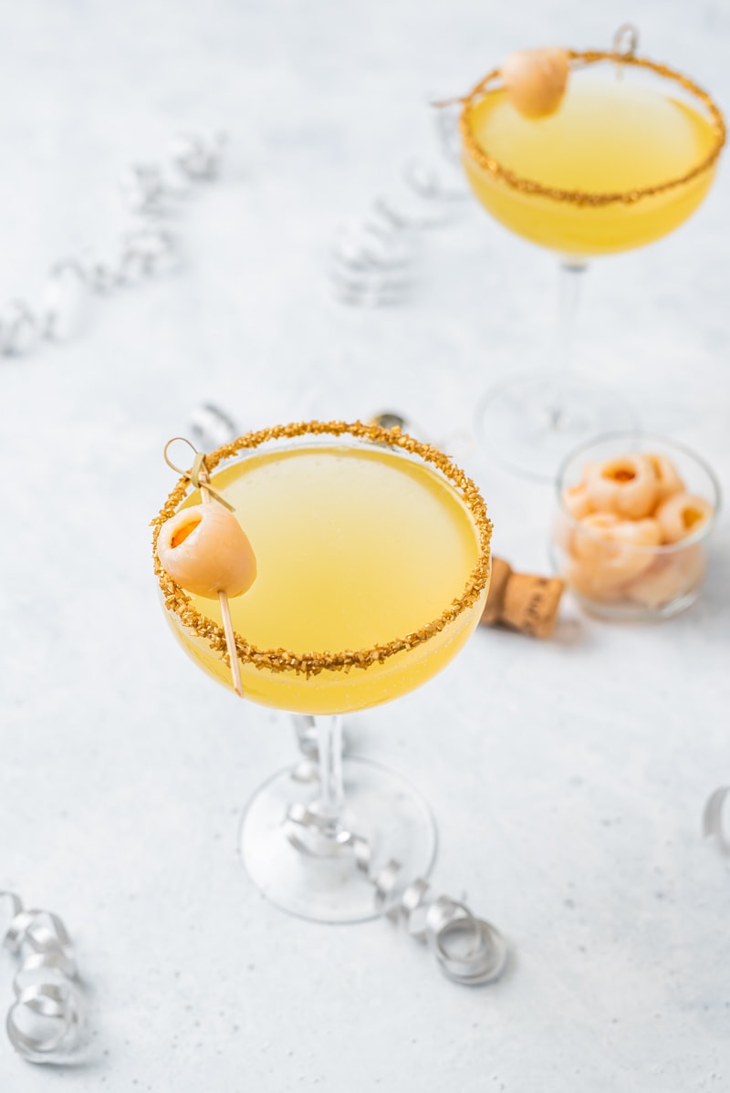 New Year’s Golden Tiki Cocktail ( Gold Rum Lychee Champagne Cocktail) www.pineappleandcoconut.com