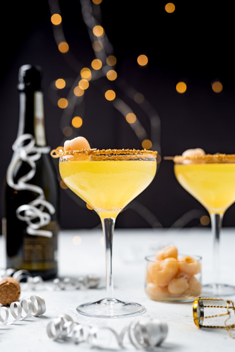 New Year’s Golden Tiki Cocktail ( Gold Rum Lychee Champagne Cocktail) www.pineappleandcoconut.com