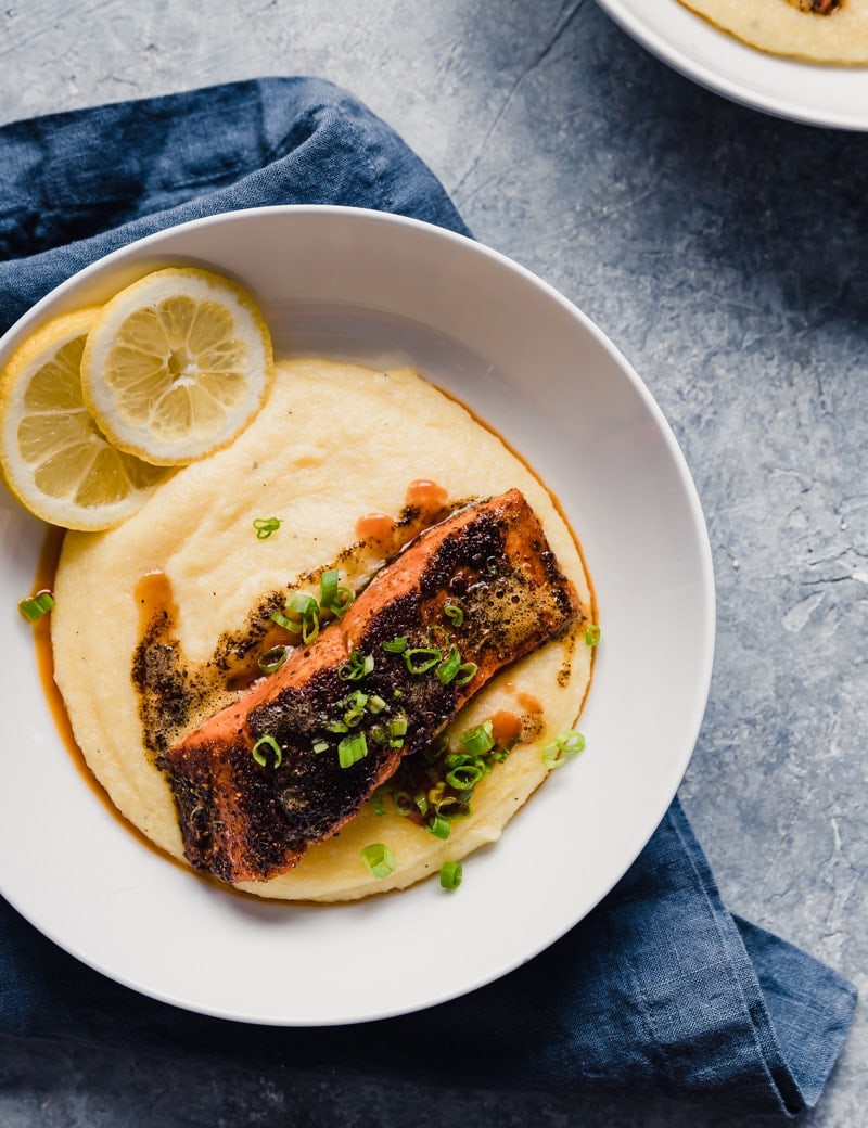 Blackened Cajun Sockeye Salmon with Smoky Cheddar Grits