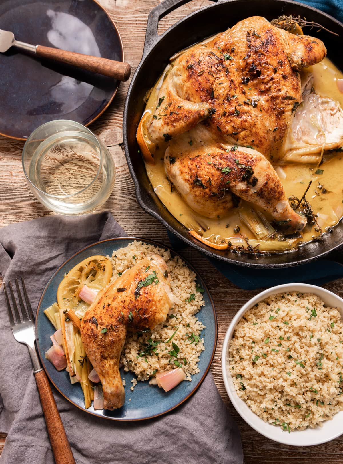 spatcocked roasted chicken in a skillet, plate of chicken with quinoa