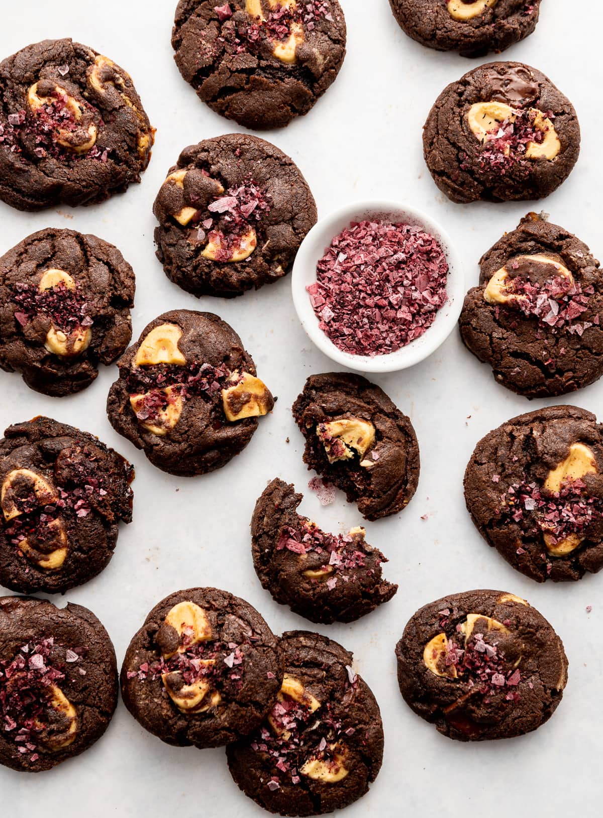 dark chocolate cookies with yellow passion fruit wafers and red hibiscus salt