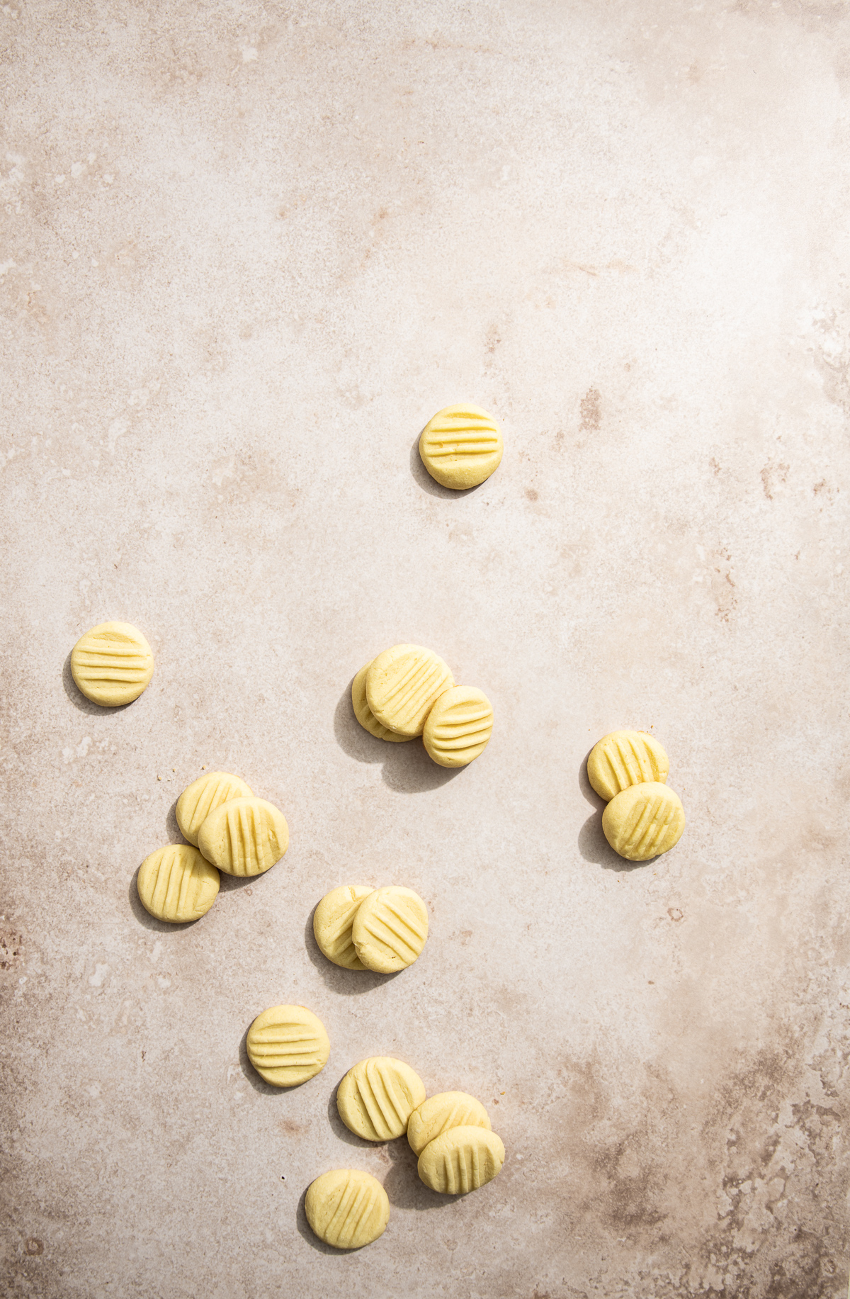round butter cookies with fork indents on top