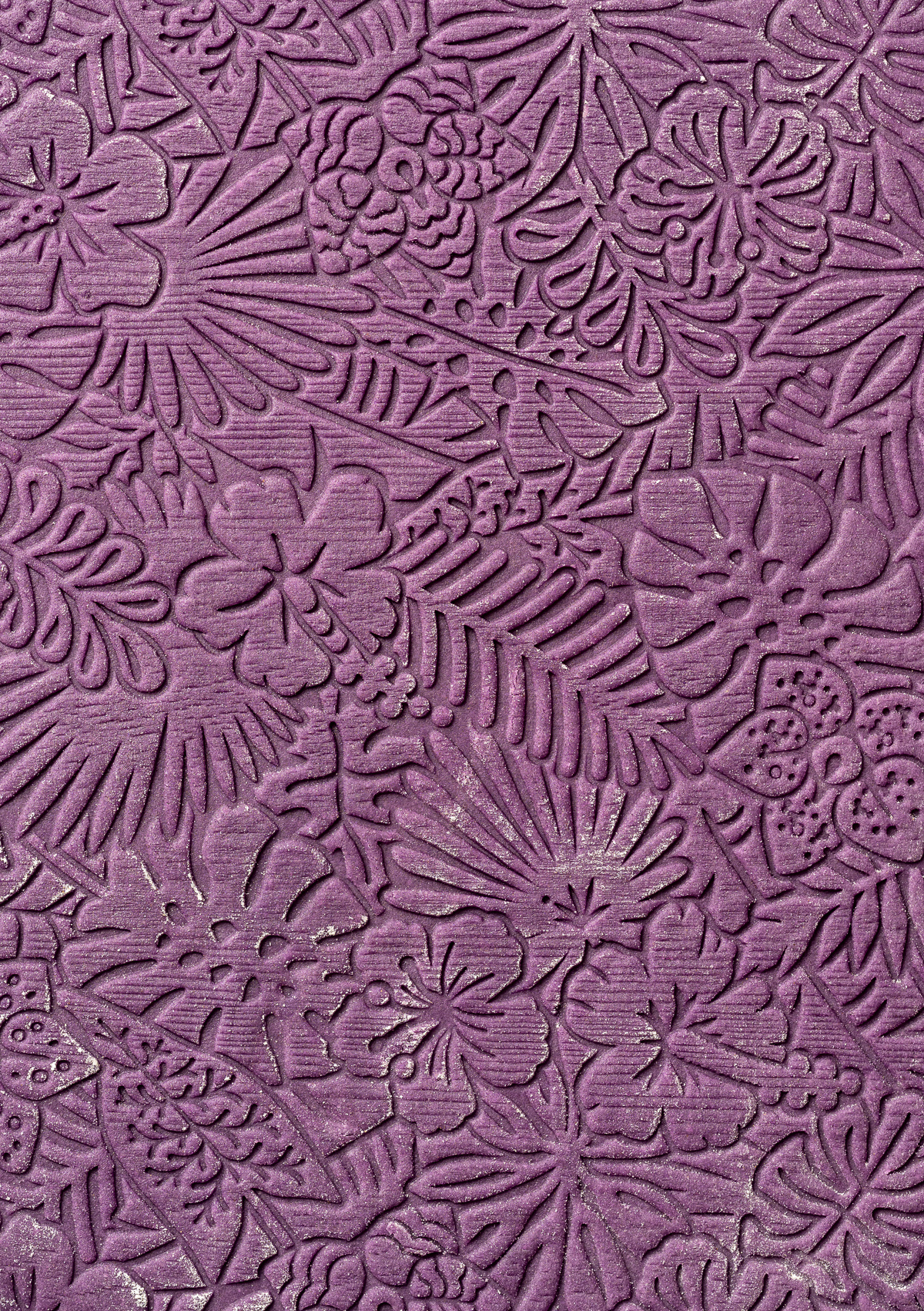 purple cookie dough embossed with tropical leaves and flowers