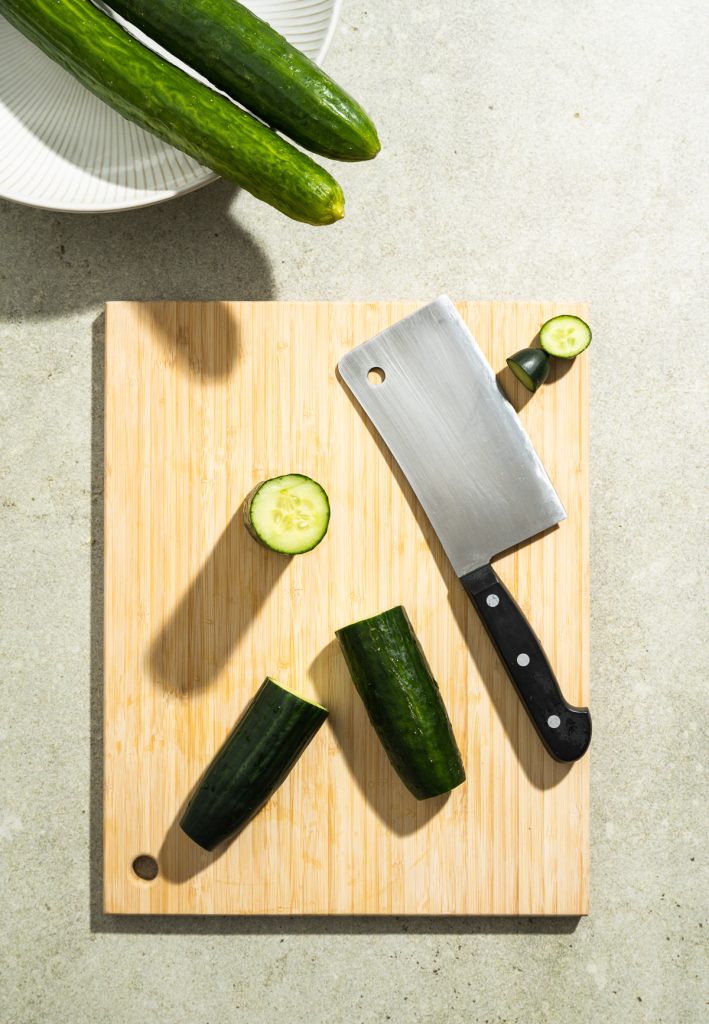 cutting board cucumbers meat cleaver
