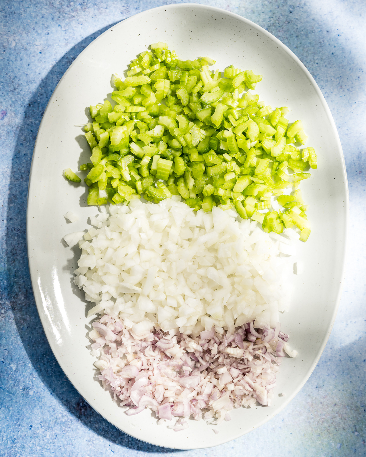 plate with diced shallot yellow onion and celery