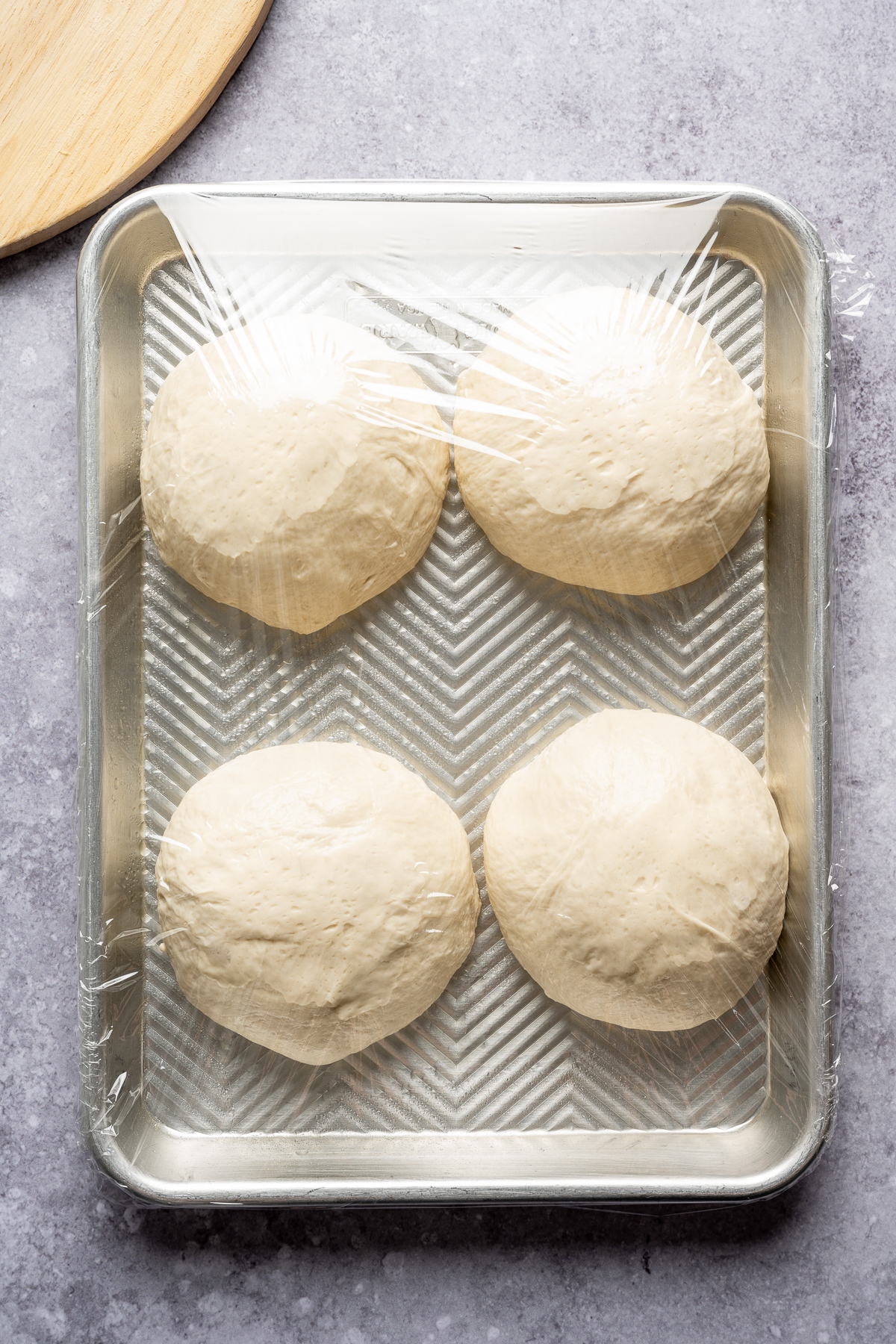 pizza dough balls on a tray