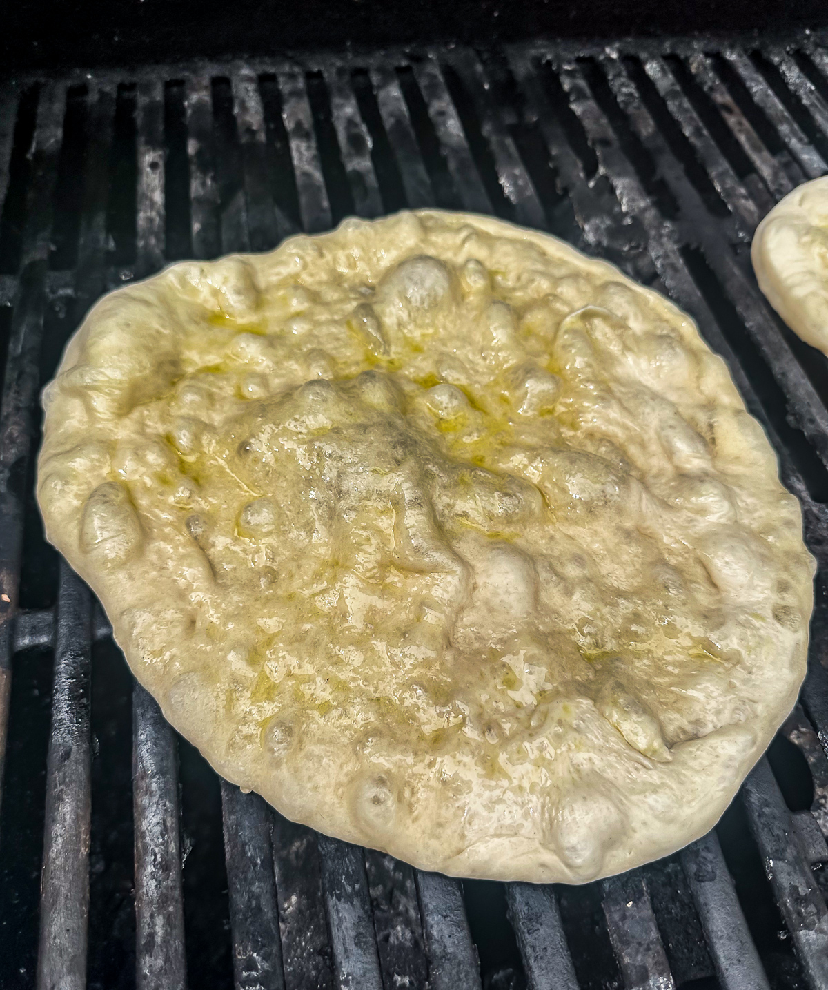 pizza dough on grill