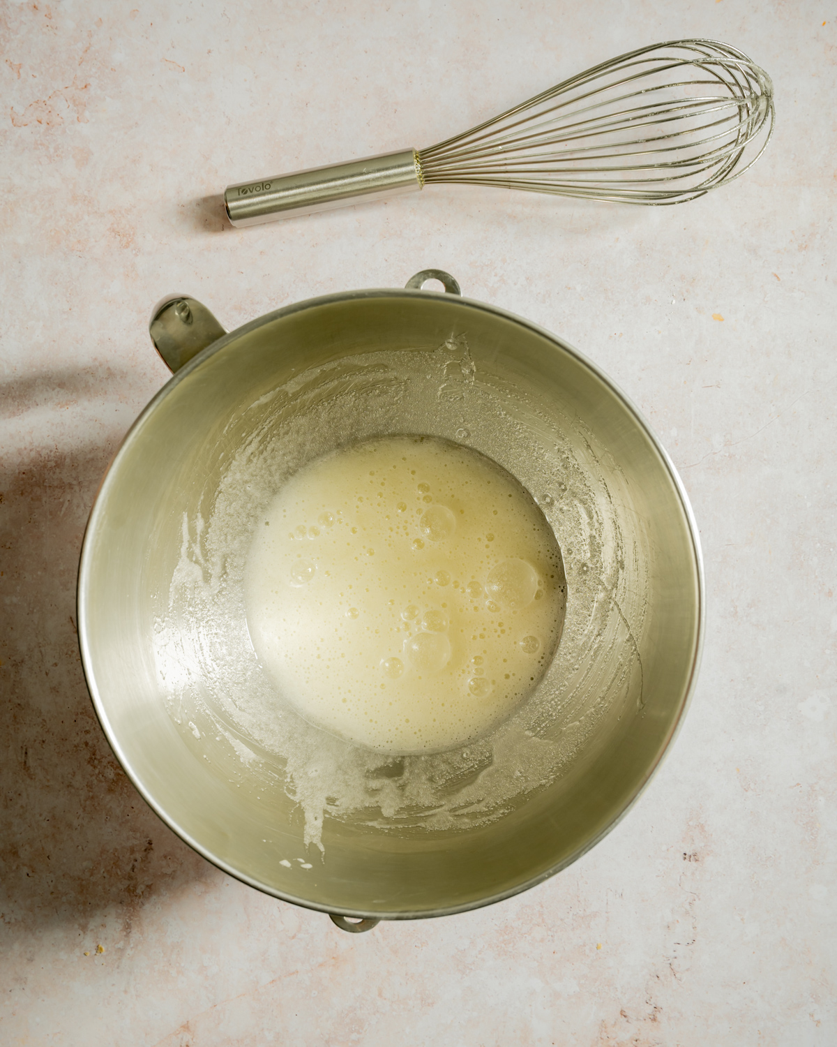whipped egg whites in bowl whisk