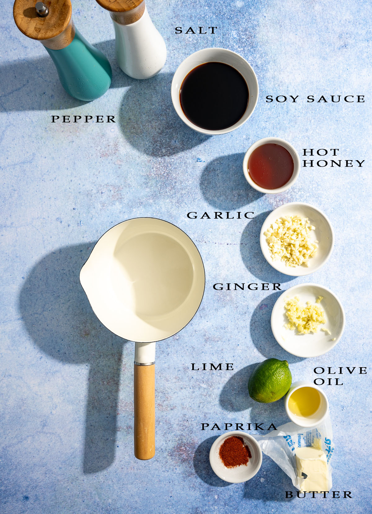 hot honey sauce ingredients in separate bowls sauce pan