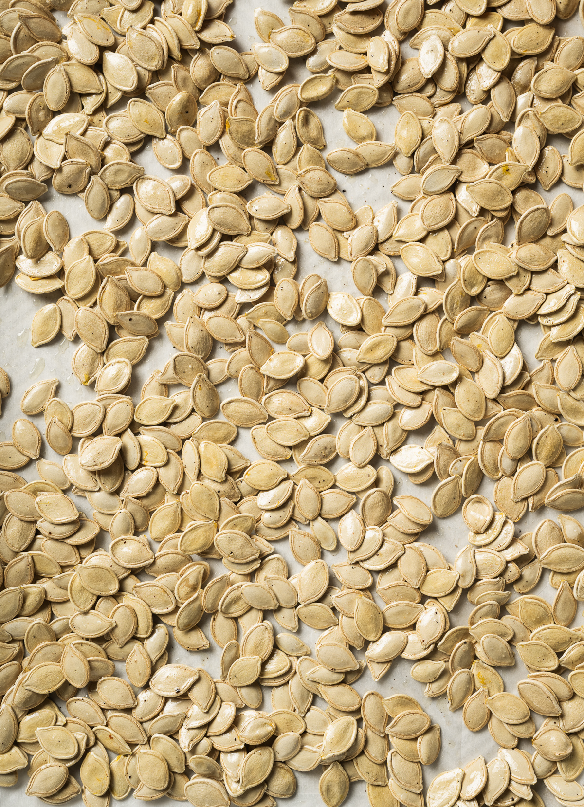 seasoned pumpkin seeds on parchment paper