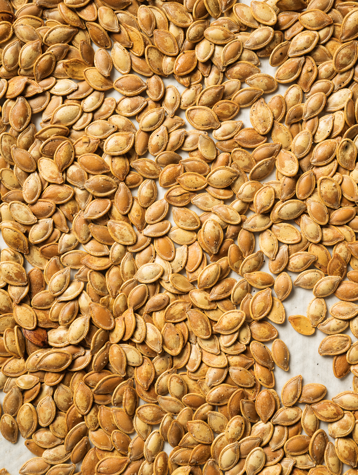 roasted pumpkin seeds on parchment paper