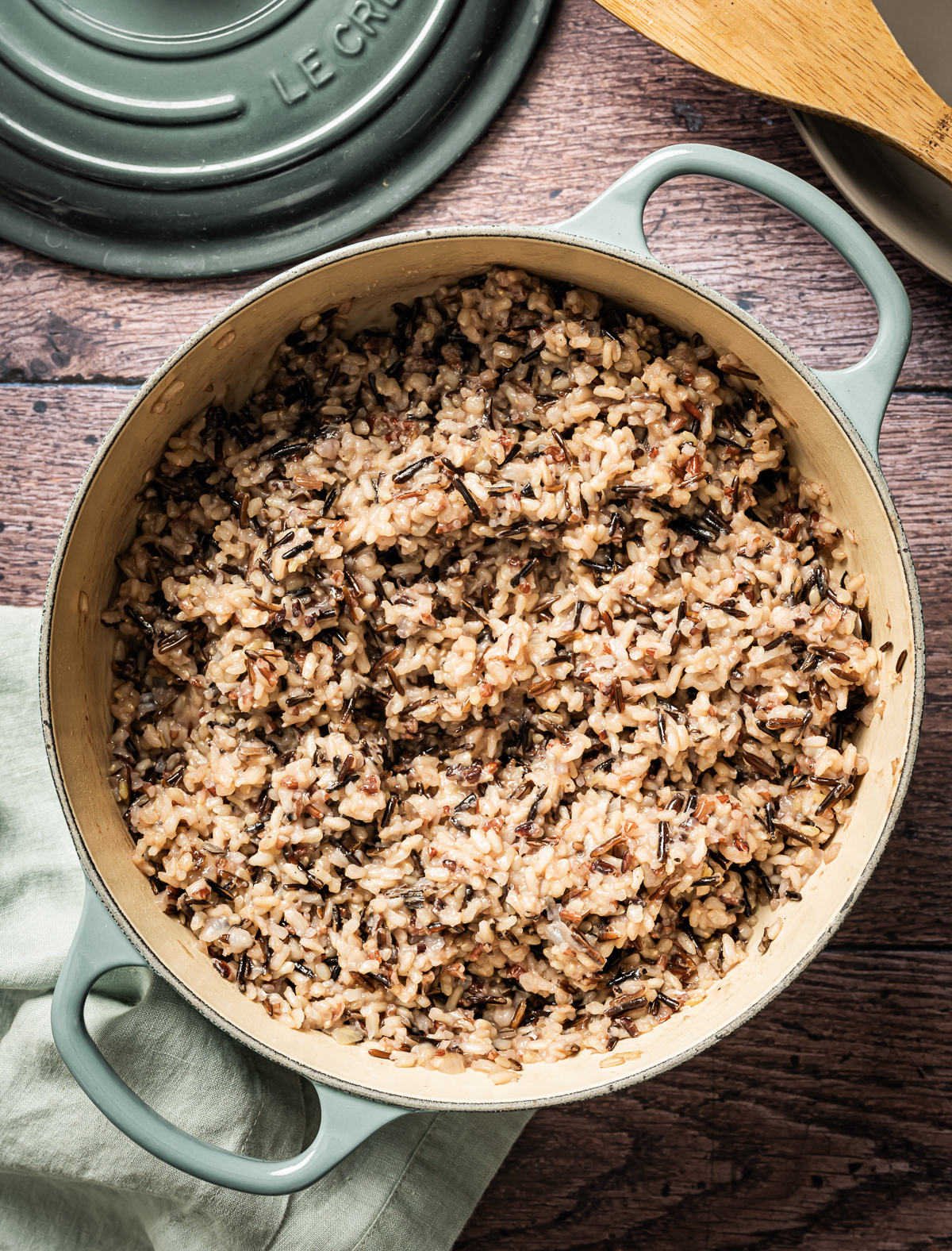 large cast iron enamel pan with cooked wild rice