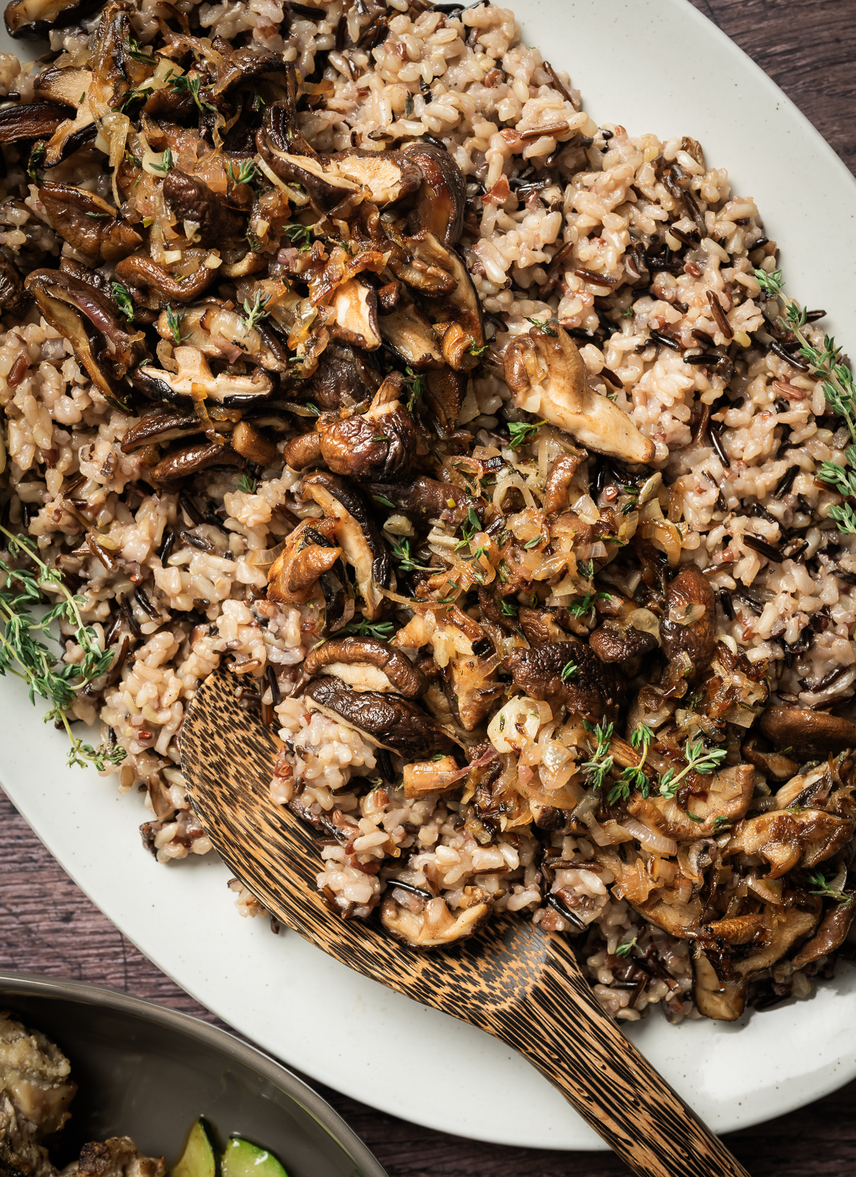 cooked wild rice topped with caramelized shallots sauteed shiitake mushrooms fresh thyme