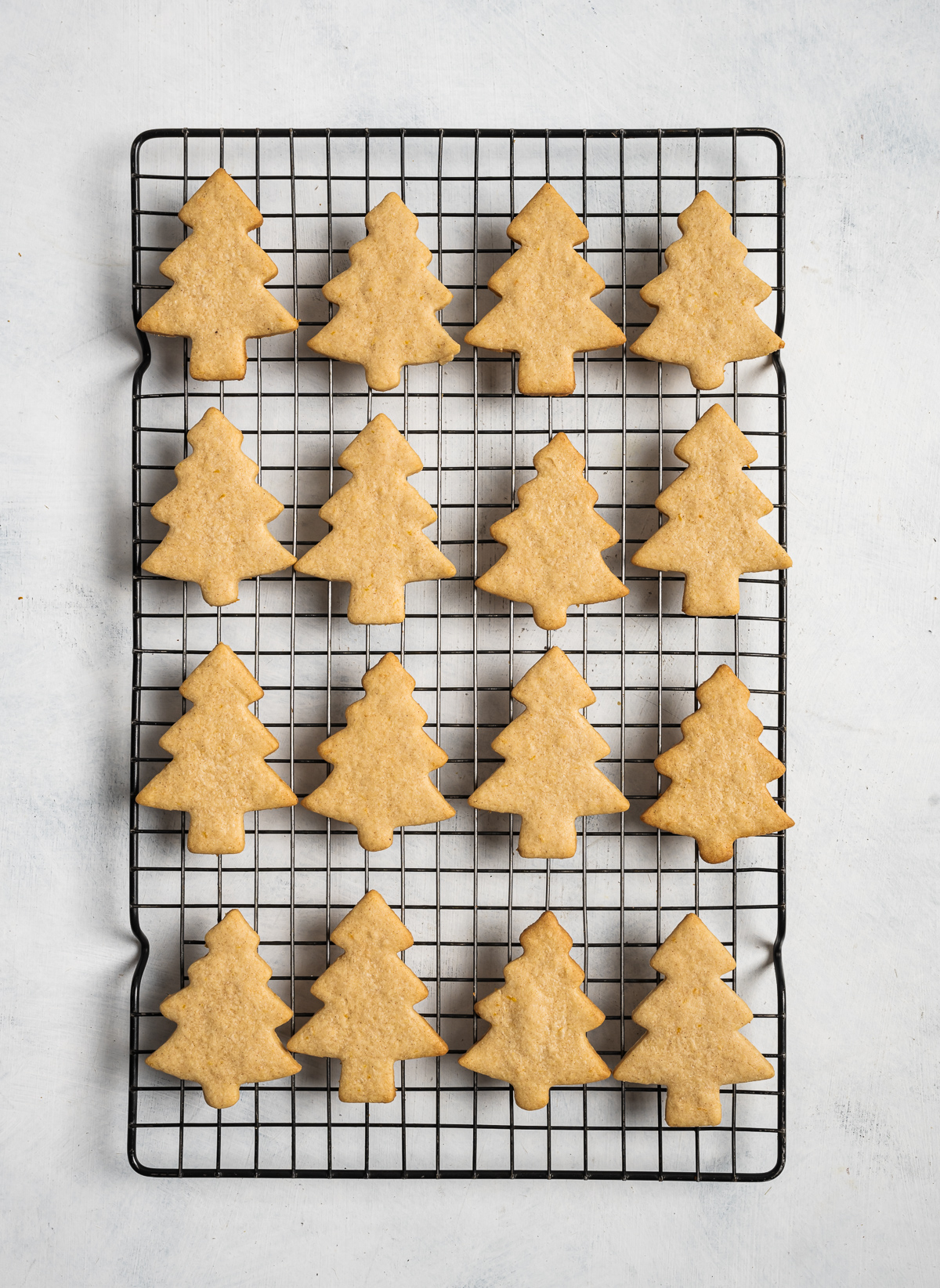 baked tree shaped cookies on wire cooling rack