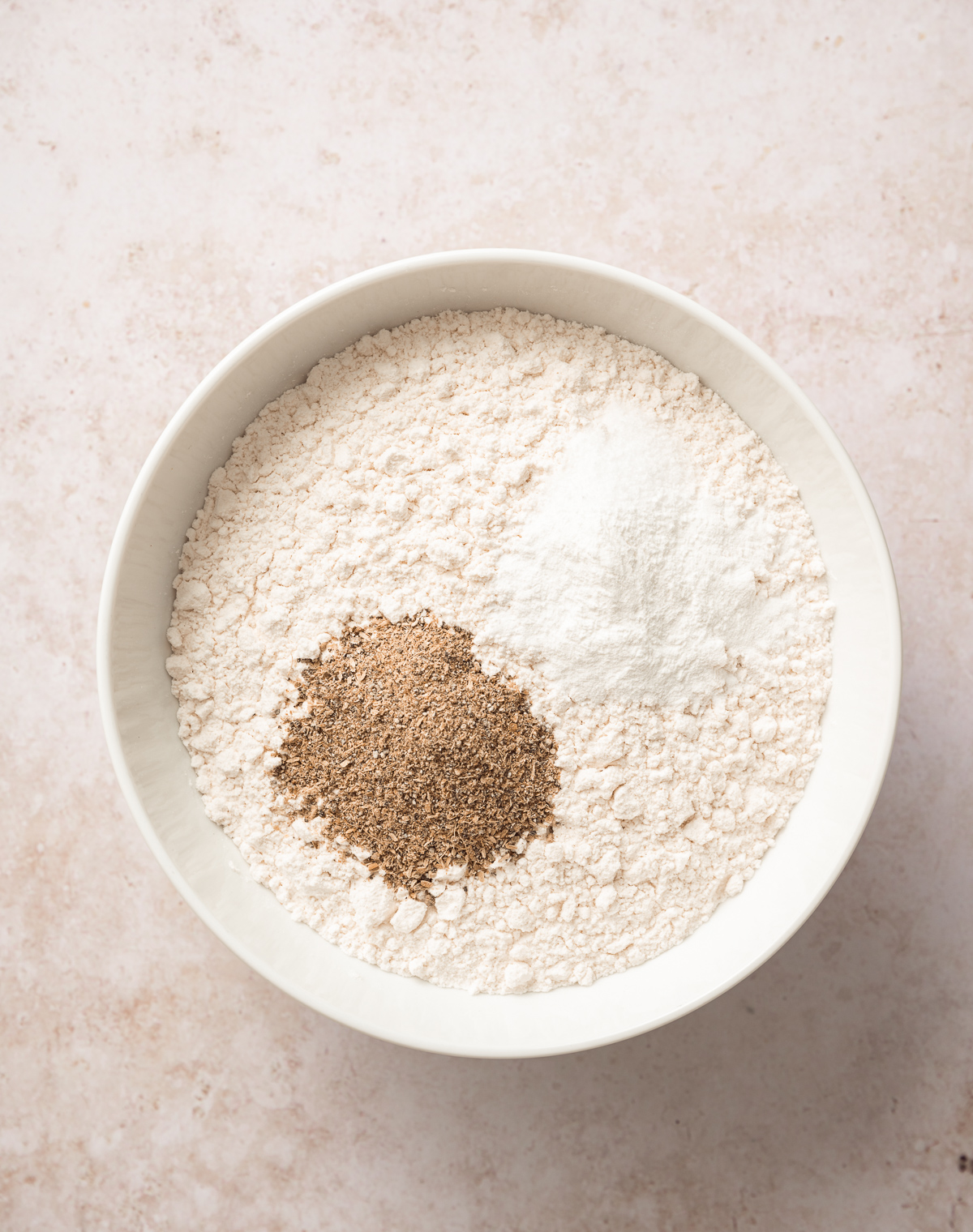 bowl of flour with salt and ground cardamom