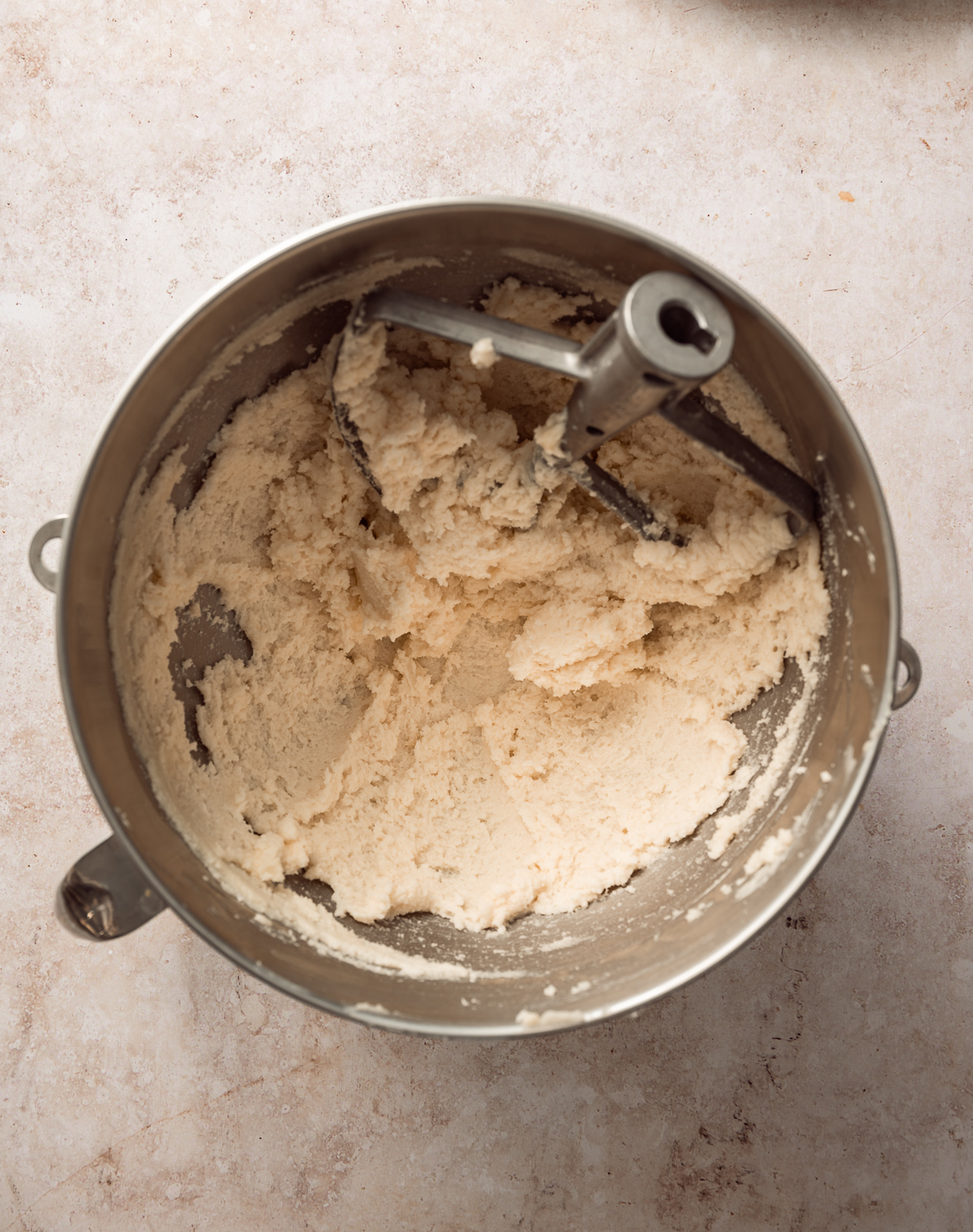 mixer bowl with butter and sugar 