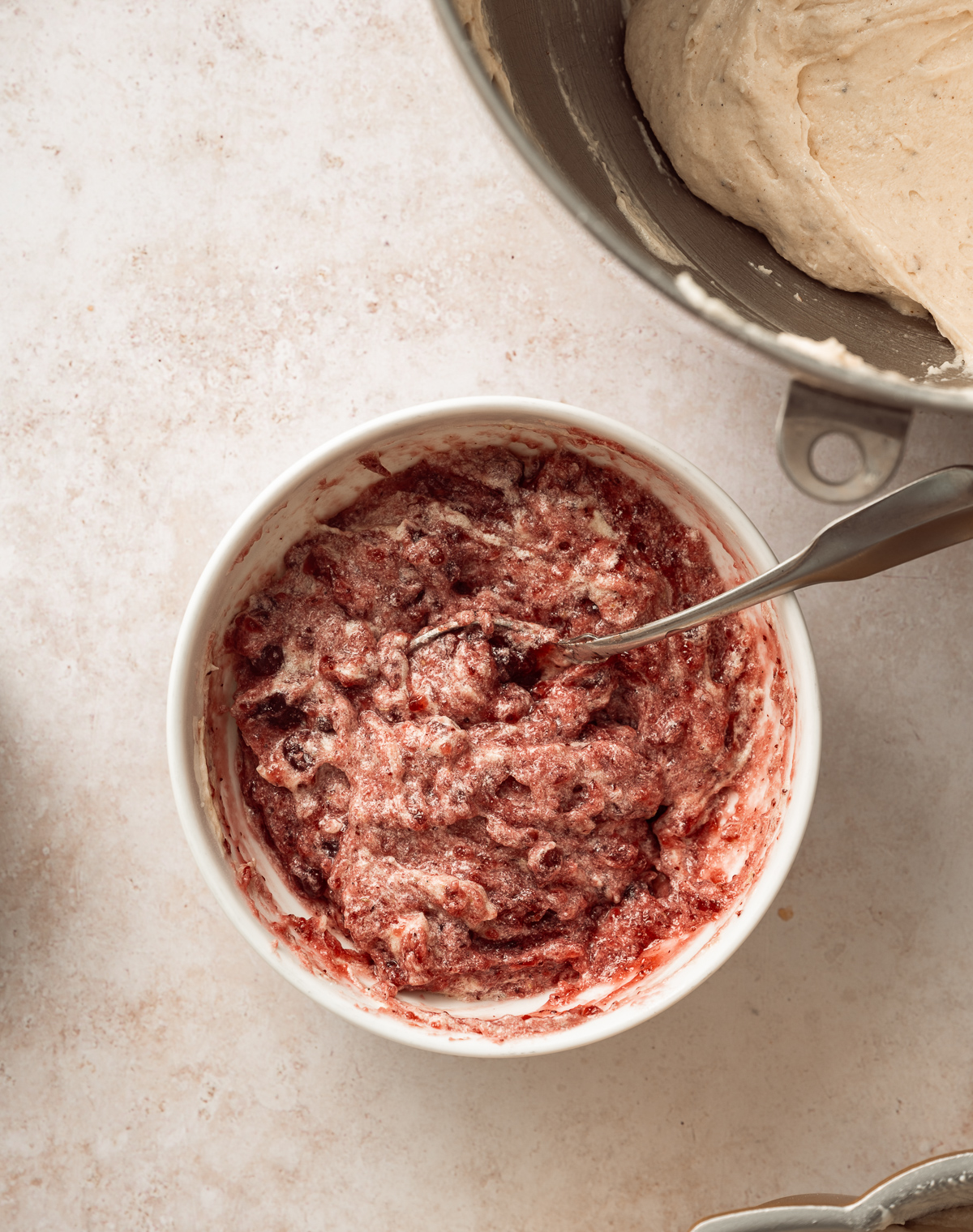 bowl of jam mixed with cake batter